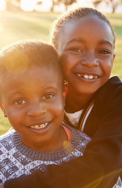 Smiling girls with Colgate brushes 